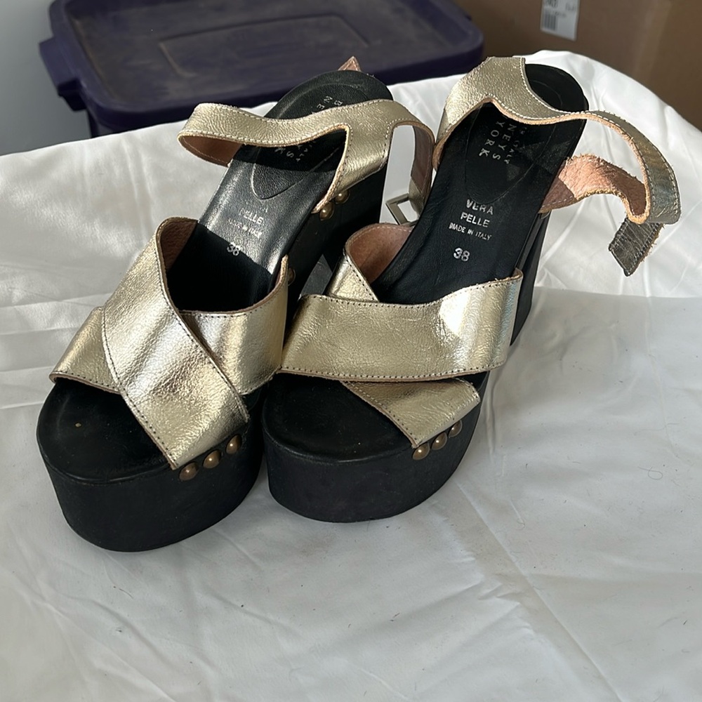 Barney’s black and gold heels